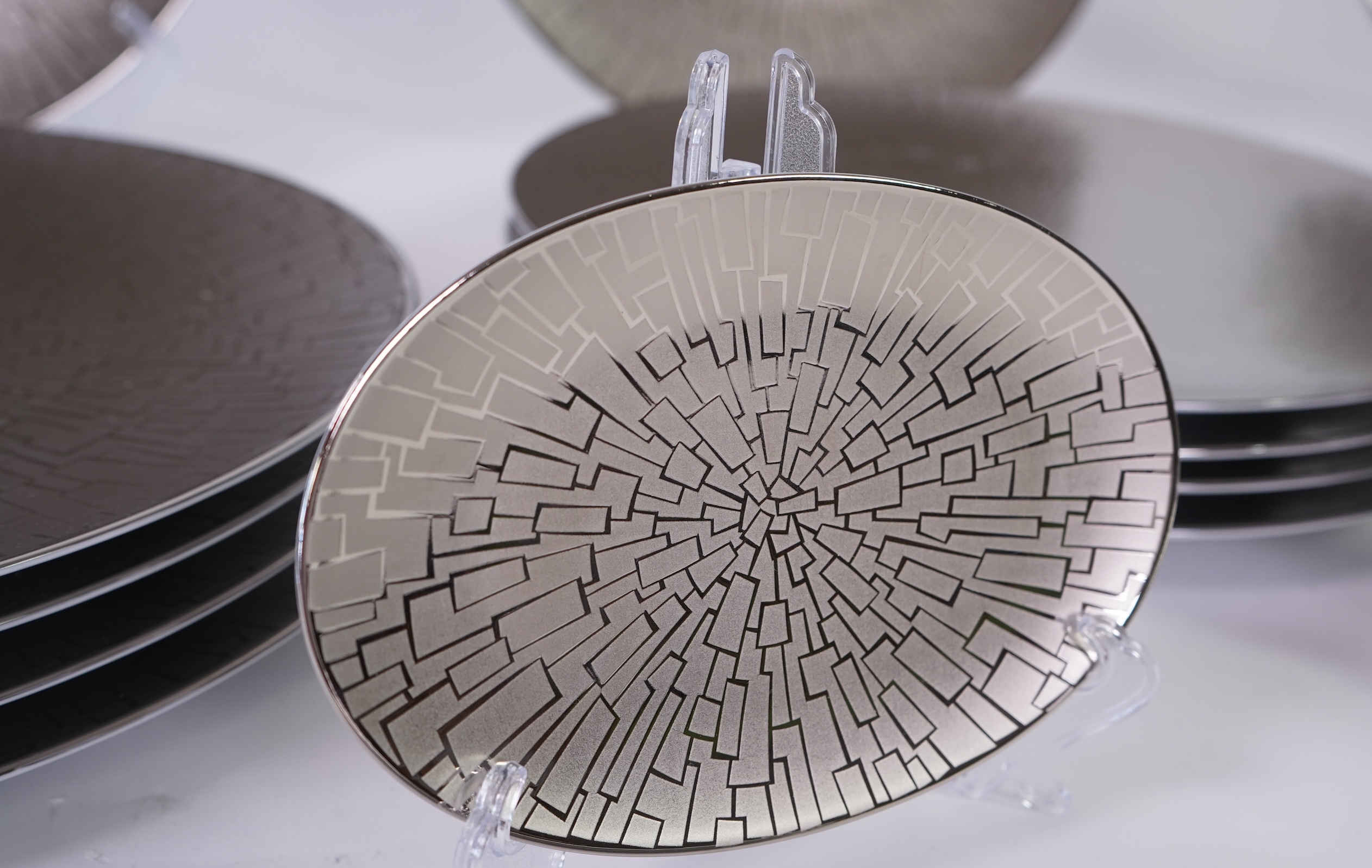 A collection of Rosenthal studio line TAC Gropius Skin platinum dinnerware, largest 33cm in diameter